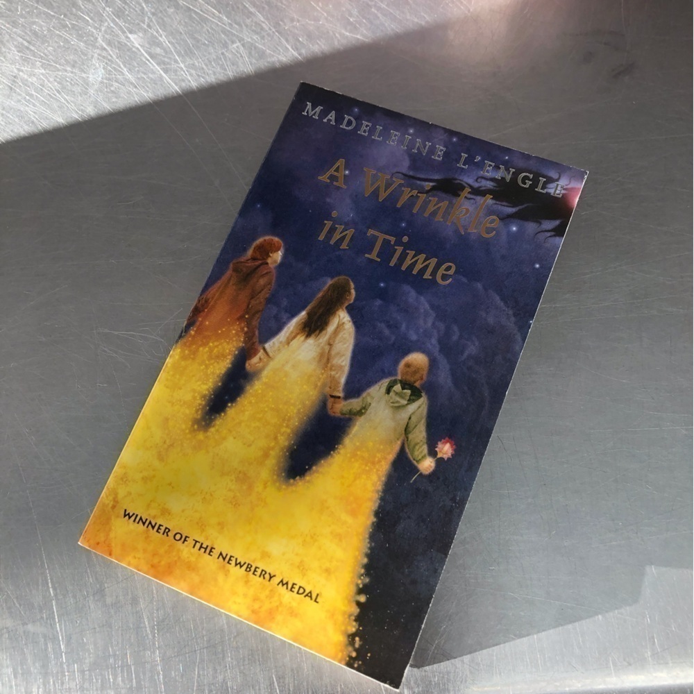 A Wrinkle in Time by: Madeleine L'engll, paperback book